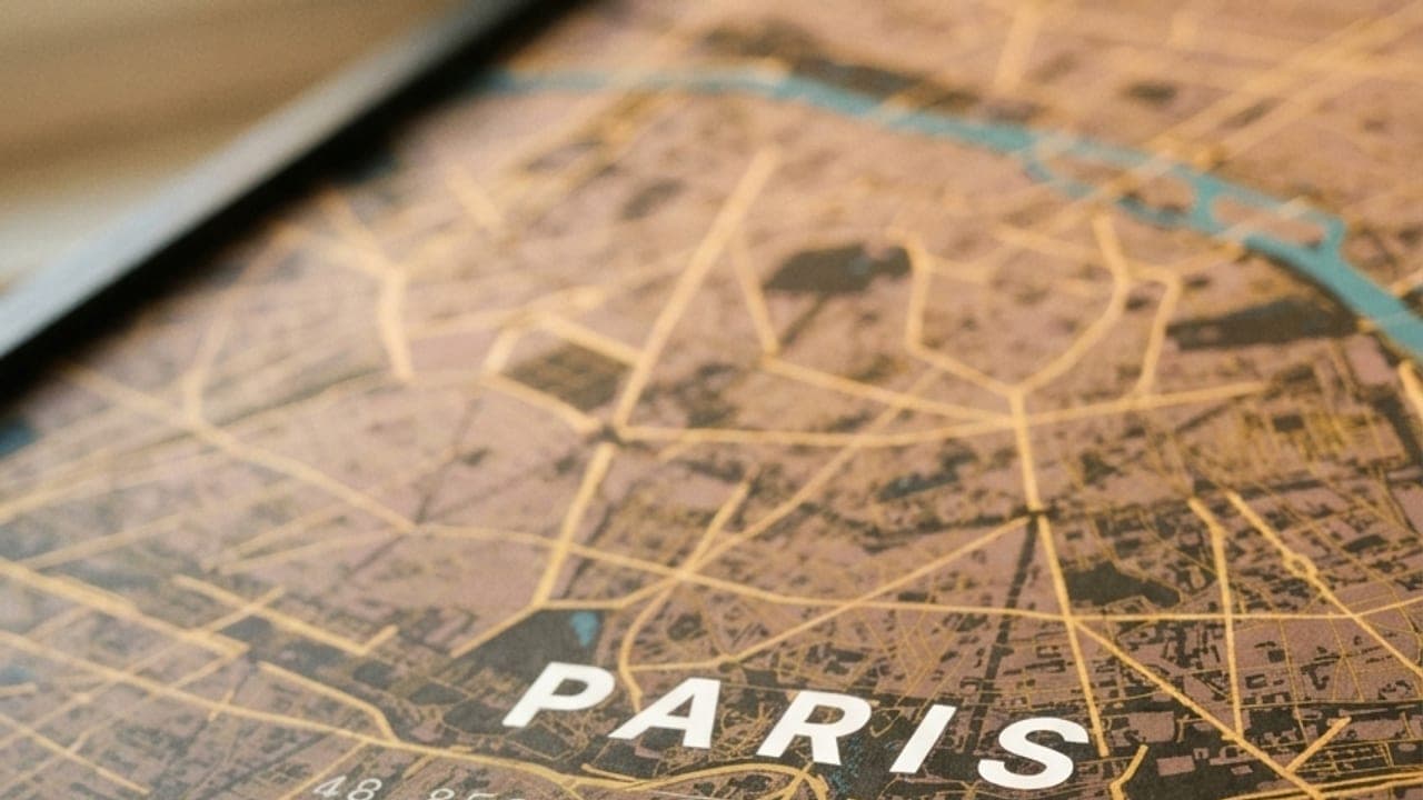 Close-up of a Paris map poster in gold and brown tones